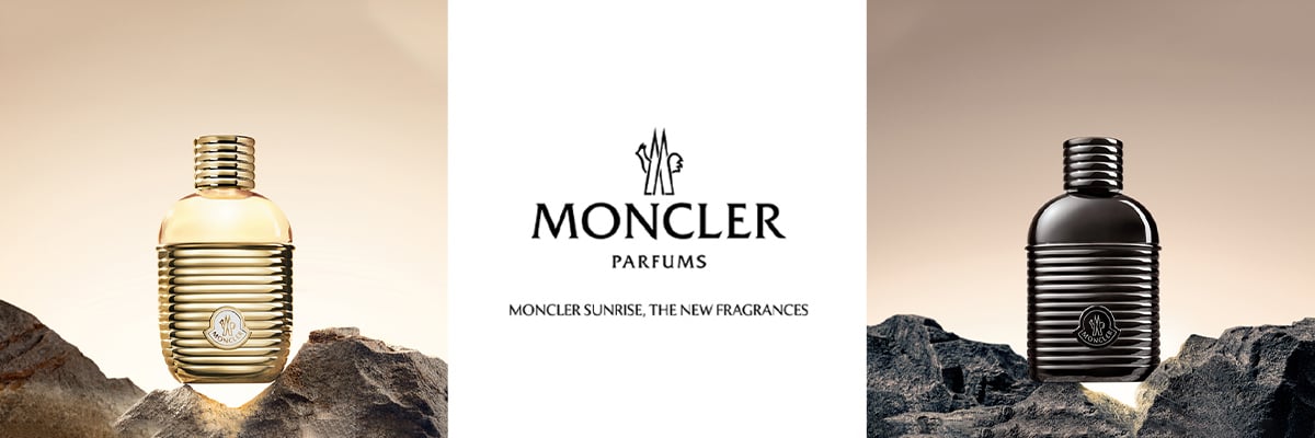 Bilde av 3 parfymer på et snøfylt høyfjell som har skutt opp fra fjellet. Det står også 2 mennesker som man ser fra et fugleperspektiv og er små i forhold til parfymen